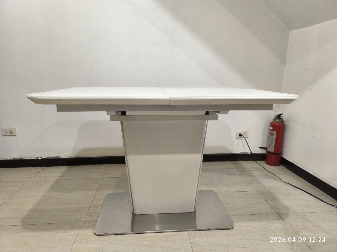 White Extendable Dining Table with Pedestal Base (Category: Tables & Sets) located in Marikina City. Submitted by ronald.santos1 (Listing ID 1440612571, Image 1). Description: - Modern white dining table - Extends to accommodate more guests - Sleek pedestal base with metal stand - Ideal for small or large gatherings - Easy-to-clean surface - Perfect for your dining room.