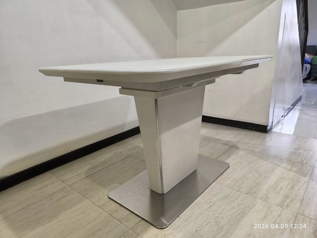 White Extendable Dining Table with Pedestal Base (Category: Tables & Sets) located in Marikina City. Submitted by ronald.santos1 (Listing ID 1440612571, Image 3). Description: - Modern white dining table - Extends to accommodate more guests - Sleek pedestal base with metal stand - Ideal for small or large gatherings - Easy-to-clean surface - Perfect for your dining room.