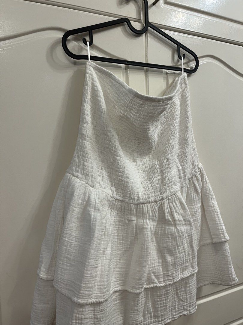 White Smocked Tiered Mini Skirt (Category: Skirts) located in Manila. Submitted by pat.98 (Listing ID 1440618296, Image 2). Description: - Cute white mini skirt - Smocked top part for a comfy fit - Tiered ruffled design for a playful look - Made from lightweight fabric, ideal for summer - Versatile and easy to pair with any top.