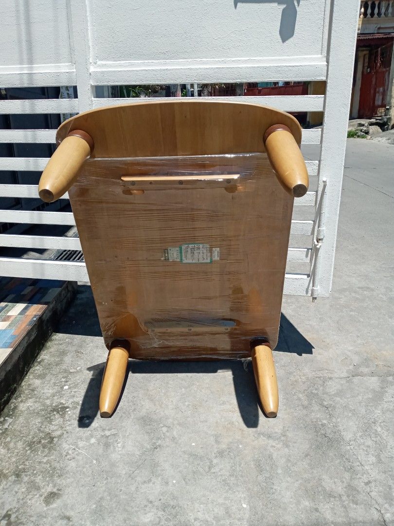 Wooden Coffee Table with Tapered Legs (Category: Tables & Sets) located in Manila. Submitted by mar.nel_1227 (Listing ID 1440754696, Image 2). Description: - Wooden coffee table with rounded edges - Features four tapered wooden legs - Surface has light scratches and wear, adding character - Underside is wrapped in plastic - Ideal for living rooms or lounge areas - Ready for its new home! 41"L x 27"W x 13"H.