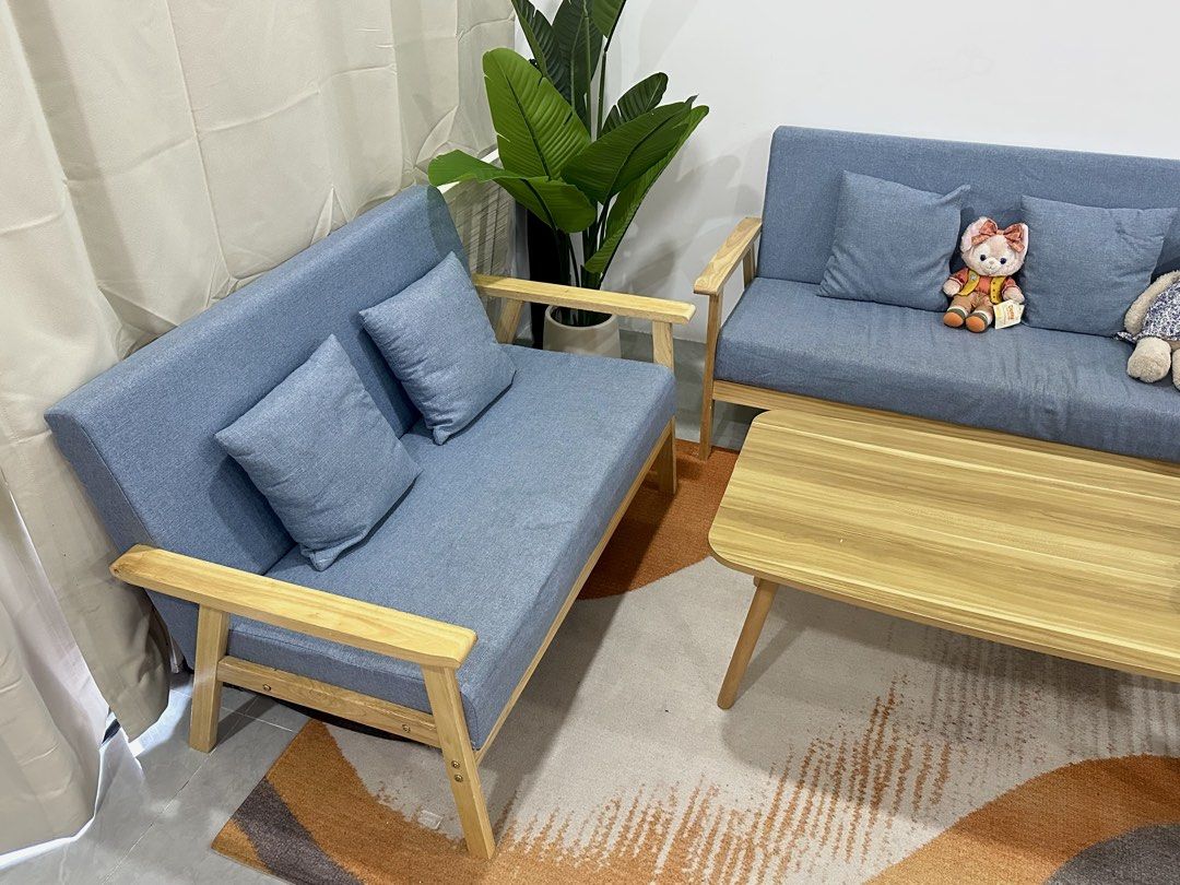 Wooden Frame Sofa Set with Blue Cushions (Category: Sofas) located in Paranaque City. Submitted by joycexu00 (Listing ID 1428195001, Image 1). Description: Nordic Style Sofa Set Like new. Inclusions: 3 seater sofa 2 seater sofa 1 seater sofa chair 1 coffee table 1 center table .