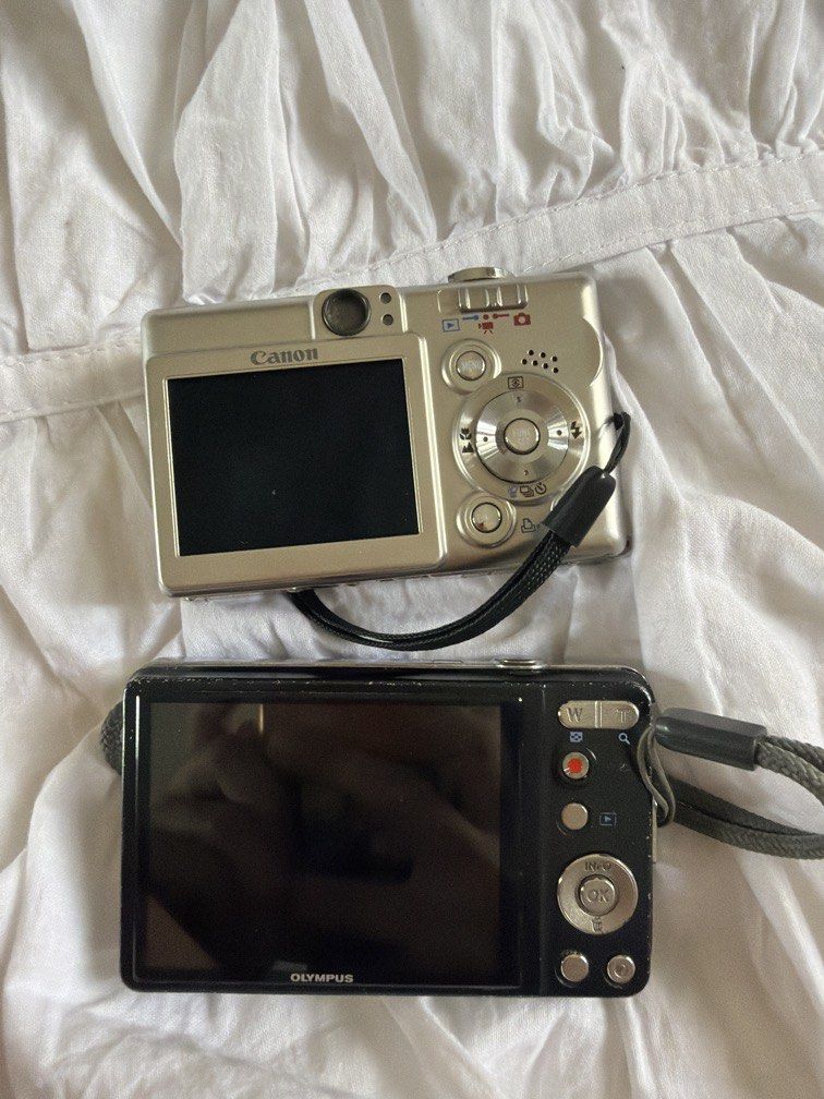 Working digi cam bundle (Category: Cameras) located in San Pedro. Submitted by spreloved1 (Listing ID 1440613473, Image 2). Description: Steal!!! BOTH WORKING but with issues Canon ixus 40 issue - lcd burn + problem with buttons (switching video and photo just have to press really hard for switch) (change batt) - ixus photos are generally nice !!! 🤎🤎🤎 Olympus vg 160 - just change battery + no battery door -- this has really nice film like phot