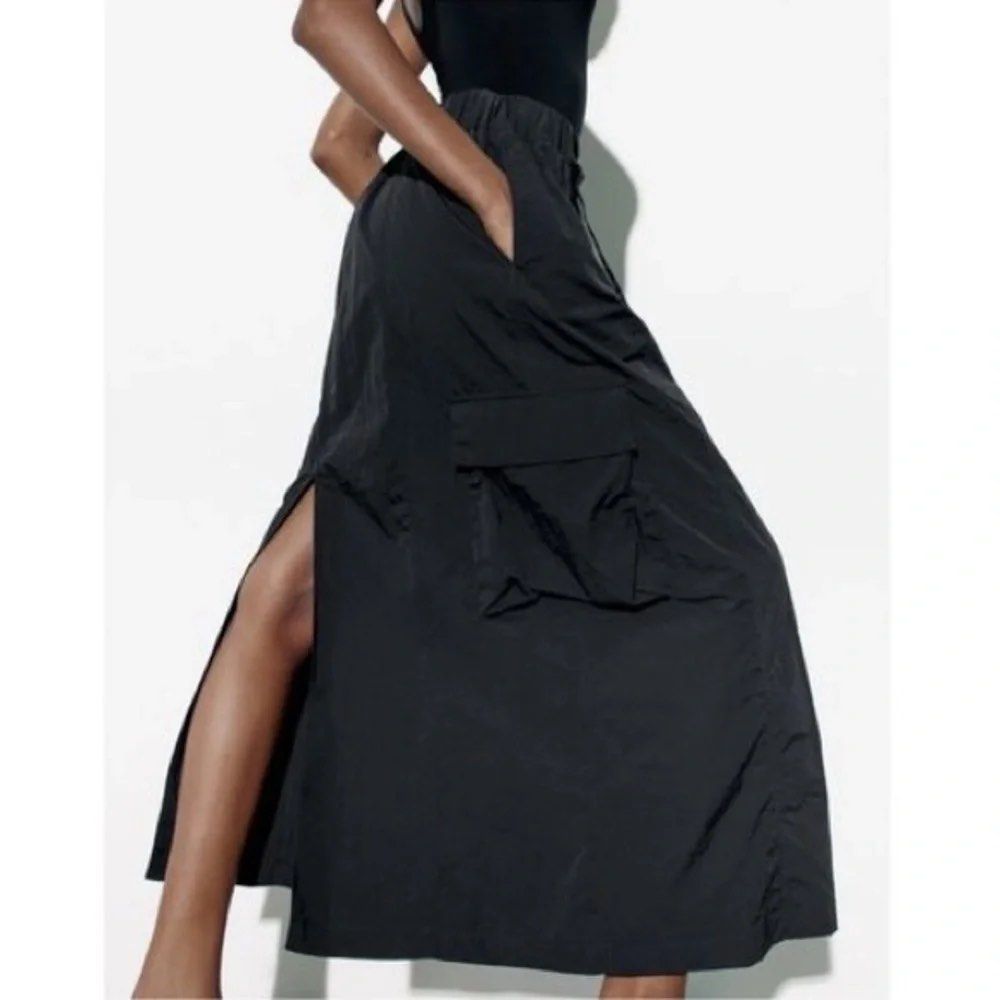 Zara Black Nylon Cargo Maxi Skirt (Category: Skirts) located in Cainta. Submitted by chaspreloved (Listing ID 1440659414, Image 2). Description: Brand new with tags, never worn Features: Elasticated waistband with drawstring and silver ring, side pockets, cargo pockets RFS: too long on me.