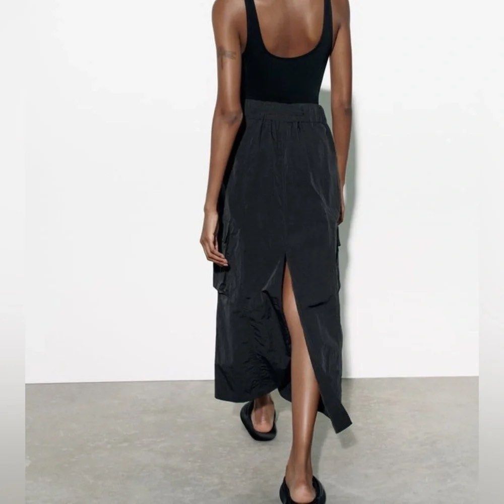 Zara Black Nylon Cargo Maxi Skirt (Category: Skirts) located in Cainta. Submitted by chaspreloved (Listing ID 1440659414, Image 3). Description: Brand new with tags, never worn Features: Elasticated waistband with drawstring and silver ring, side pockets, cargo pockets RFS: too long on me.