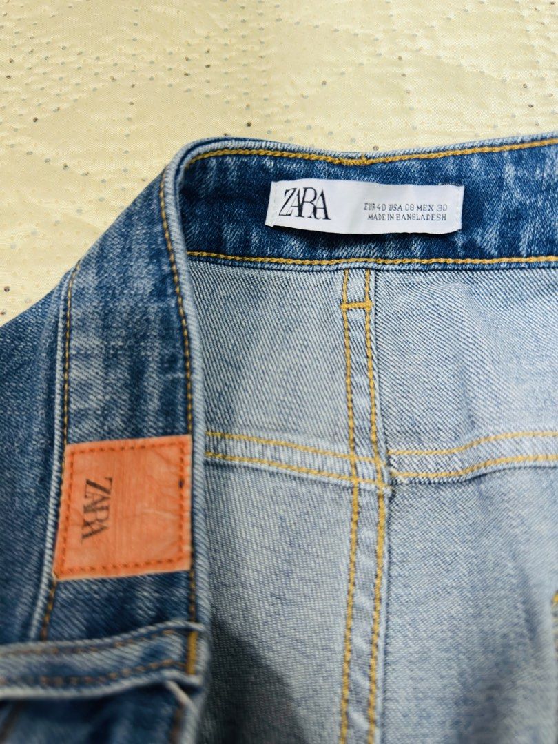 ZARA Blue Distressed Denim Jeans (Category: Jeans) located in Calamba. Submitted by nympha0630 (Listing ID 1440640094, Image 3). Description: - ZARA Blue Denim Jeans - Distressed look with rips - Frayed hems - Straight leg style - Comfortable for everyday wear - Please check photos for details Like new Size 30 waistline.