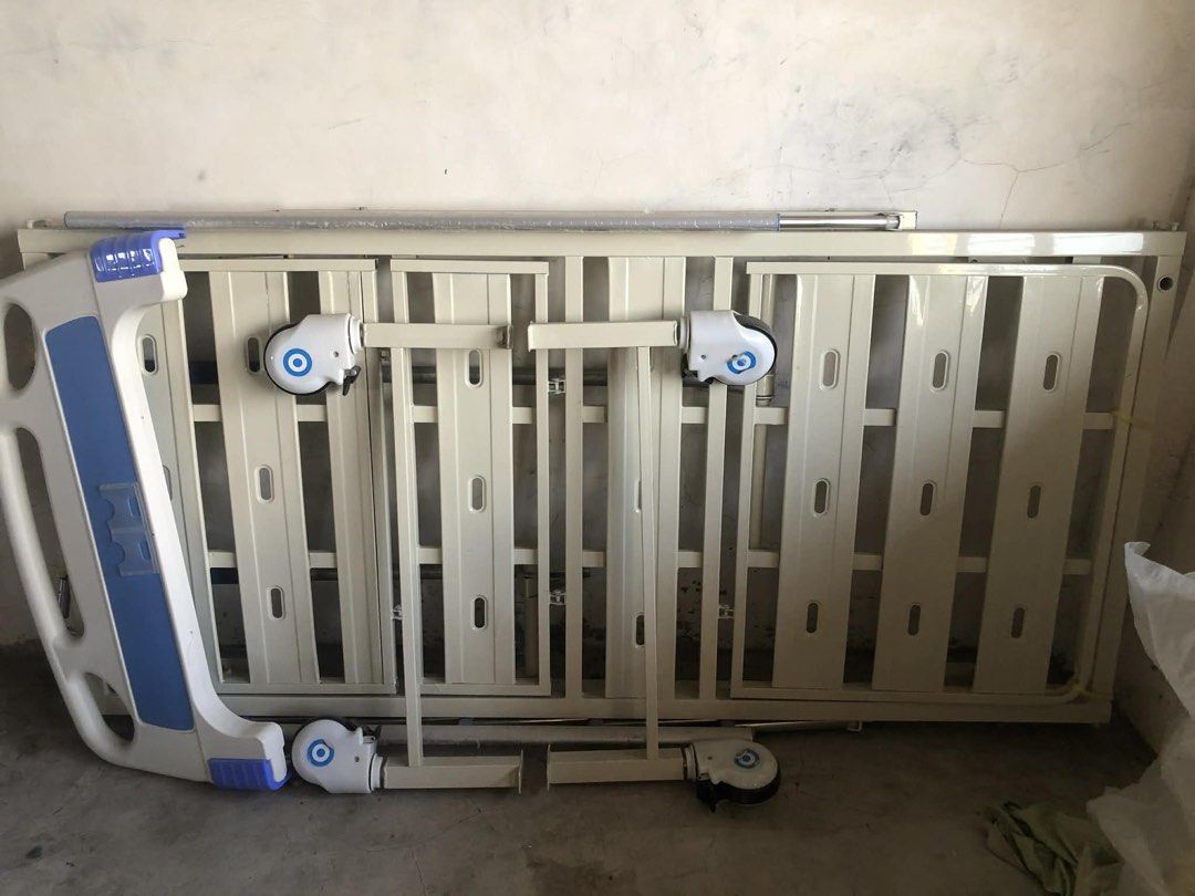 Adjustable Hospital Bed with free Mattress (Category: Bed Frames & Mattresses) located in Taguig. Submitted by amorzy (Listing ID 1435793580, Image 2). Description: - Adjustable hospital bed - Sturdy frame - Multiple adjustment points - Includes side rails - Features wheels for easy movement - Suitable for home or clinical use.
