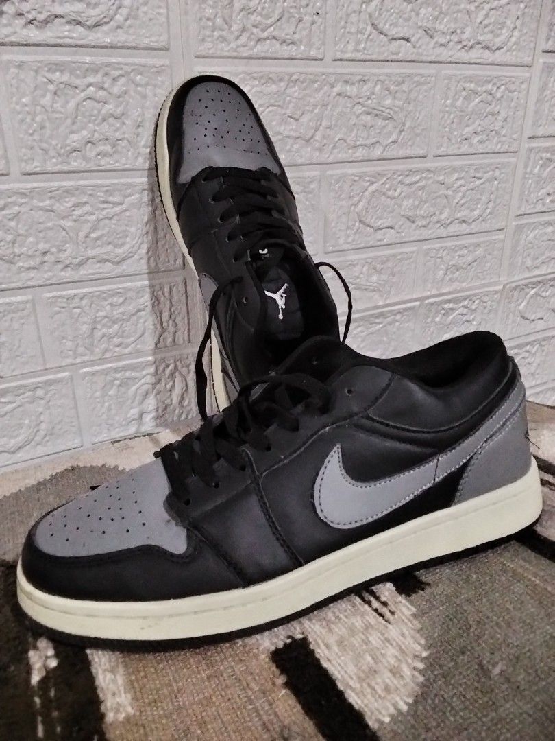 Air Jordan 1 Low Black Grey (Category: Sneakers) located in Marikina City. Submitted by cinderellagarcia1982 (Listing ID 1435714509, Image 2). Description: - Air Jordan 1 Low sneakers - Color: Black and Grey - Features Nike swoosh - Air Jordan logo on the heel - Black laces - White sole - Grey toe box and heel - Black body.