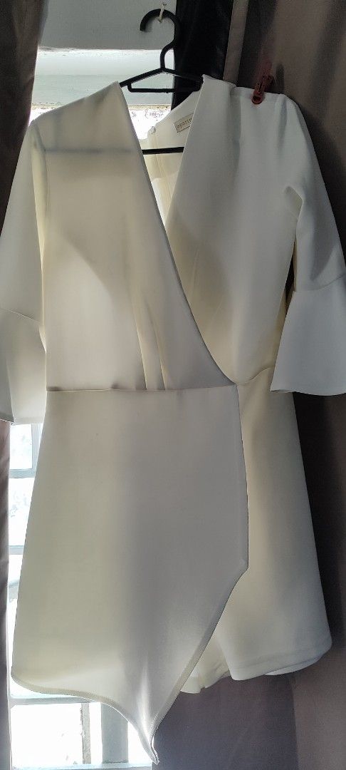 Apartment Eight White Dress (Category: Dresses) located in Angeles City. Submitted by motherhood17 (Listing ID 1435726346, Image 1). Description: - Apartment Eight white dress - Wrap-style design - V-neckline - Flared sleeves - Asymmetrical hem - Lightweight, smooth fabric - Perfect for special occasions or everyday wear.
