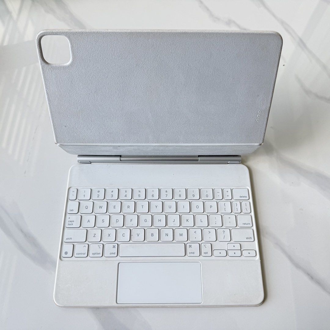 Apple Magic Keyboard 11” iPad Pro/Air (White, A2261) (Category: Cases & Sleeves) located in Manila. Submitted by kristelscloset316 (Listing ID 1435738089, Image 2). Description: Bought brand new at 20,990 Used, very minor yellowing .