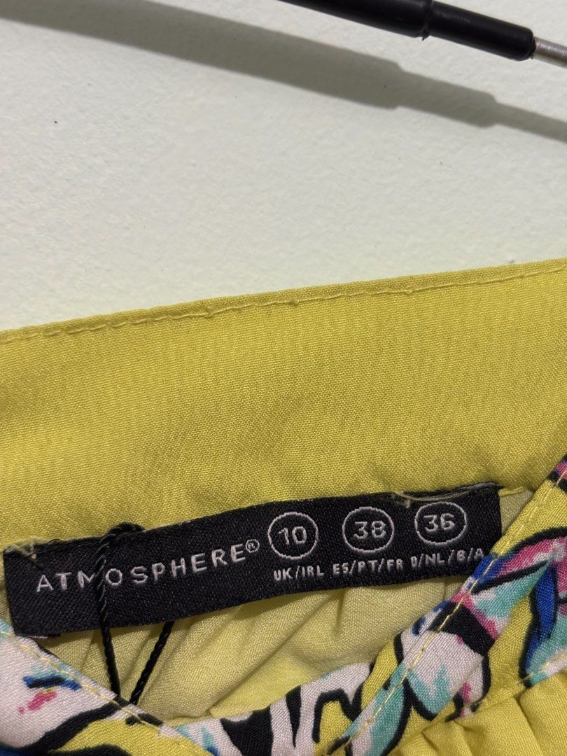 Atmosphere Floral Maxi Skirt (Category: Skirts) located in Paete. Submitted by reeia.thrift.shop (Listing ID 1435827911, Image 2). Description: Yellow maxi skirt from Atmosphere. Features a vibrant floral print in blue, pink, and white. Size 10 UK, 38 EU, and 36 DE. About 28 inches waist. Perfect for a casual day out or a summer event. The skirt is long and flowy..