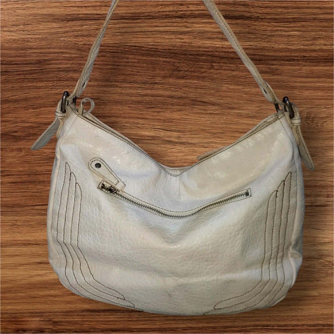 Auth Jessica Simpson Pebbled Leather Hobo Bag (Category: Shoulder Bags) located in Cebu City. Submitted by jc_online_shop (Listing ID 1435719583, Image 3). Description: 12" x 10" x 4" bone white color adjustable strap.