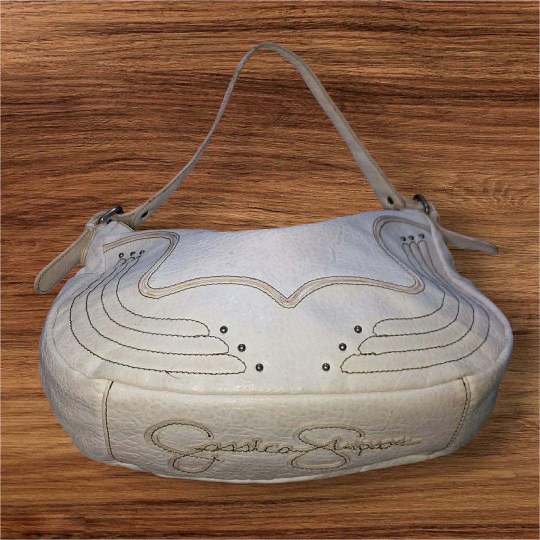 Auth Jessica Simpson Pebbled Leather Hobo Bag (Category: Shoulder Bags) located in Cebu City. Submitted by jc_online_shop (Listing ID 1435719583, Image 2). Description: 12" x 10" x 4" bone white color adjustable strap.