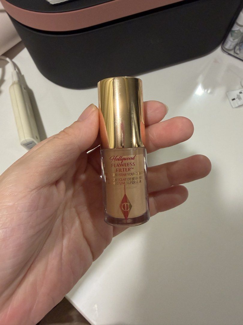 Authentic Charlotte Tilbury Mini Hollywood Flawless Filter 2.5 (Category: Makeup) located in Manila. Submitted by act92 (Listing ID 1435857662, Image 3). Description: - Charlotte Tilbury Hollywood Flawless Filter - Shade: 2.5 Fair Clair - Size: 5.5 ml / 0.18 fl. oz. - Achieve a superstar glow! - Packaging: Light pink box with gold accents; clear bottle with gold cap. Like new! Only swatched once, at the back of my hand only, not on my face. Authe