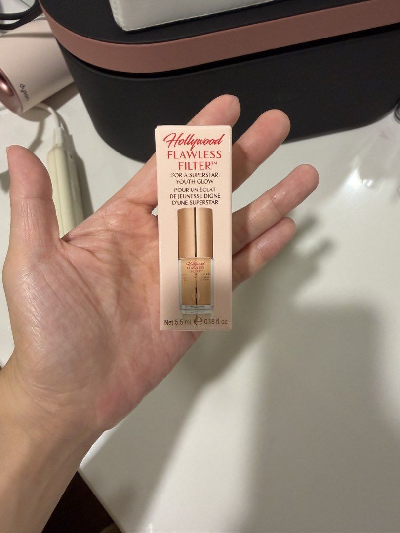 Authentic Charlotte Tilbury Mini Hollywood Flawless Filter 2.5 (Category: Makeup) located in Manila. Submitted by act92 (Listing ID 1435857662, Image 1). Description: - Charlotte Tilbury Hollywood Flawless Filter - Shade: 2.5 Fair Clair - Size: 5.5 ml / 0.18 fl. oz. - Achieve a superstar glow! - Packaging: Light pink box with gold accents; clear bottle with gold cap. Like new! Only swatched once, at the back of my hand only, not on my face. Authe