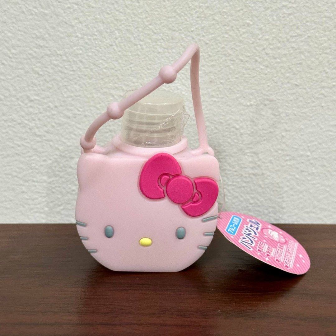 [Authentic] Sanrio Hello Kitty Hand Gel Holder Bottle (30ml) (Category: Character Goods) located in Quezon City. Submitted by brandedusagoodies (Listing ID 1435863482, Image 1). Description: Cute and compact Hello Kitty hand gel bottle with a soft silicone holder and strap, perfect for on-the-go use. Ideal for attaching to bags or keys for easy access. Material: - Silicone (holder) / PET Plastic (bottle) Color / Design: - Soft pink Hello Kitty fa