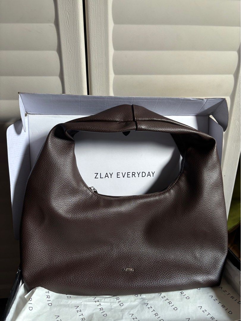 Aztrid Hobo Bag Medium in Brown (Category: Luxury Bags & Wallets) located in Manila. Submitted by declutterwithroycie (Listing ID 1435751600, Image 1). Description: aztrid hobo bag in medium (brown) see photos for condition with dust bag and box .