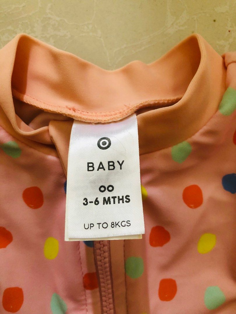 Baby Rashguard for swimming (Category: Babies & Kids Fashion) located in Las Pinas. Submitted by bibliomomma (Listing ID 1435718103, Image 3). Description: Target Size 3-6months Adorable pink baby rashguard romper with colorful polka dots, long sleeves for sun protection, and a front zipper for easy changing. Lightweight, quick-drying, and gently used, perfect for swim or beach days. MOP Gcash.