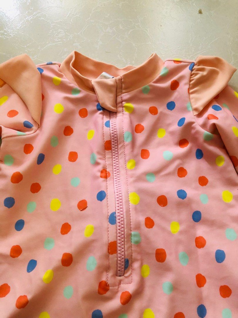 Baby Rashguard for swimming (Category: Babies & Kids Fashion) located in Las Pinas. Submitted by bibliomomma (Listing ID 1435718103, Image 2). Description: Target Size 3-6months Adorable pink baby rashguard romper with colorful polka dots, long sleeves for sun protection, and a front zipper for easy changing. Lightweight, quick-drying, and gently used, perfect for swim or beach days. MOP Gcash.