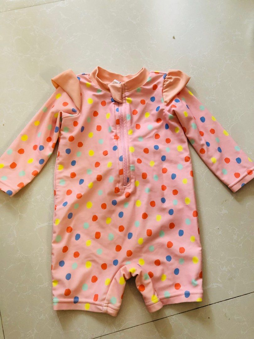 Baby Rashguard for swimming (Category: Babies & Kids Fashion) located in Las Pinas. Submitted by bibliomomma (Listing ID 1435718103, Image 1). Description: Target Size 3-6months Adorable pink baby rashguard romper with colorful polka dots, long sleeves for sun protection, and a front zipper for easy changing. Lightweight, quick-drying, and gently used, perfect for swim or beach days. MOP Gcash.