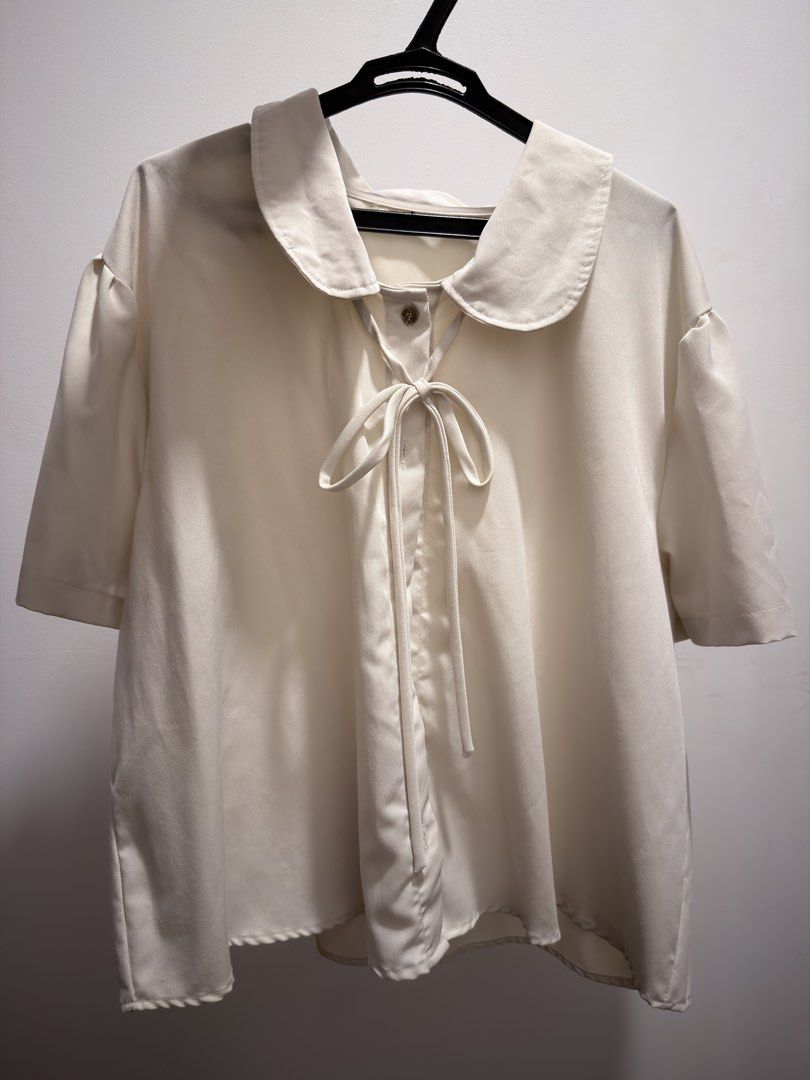bangkok plus size cream peter pan collar blouse (Category: Blouses) located in Pasig City. Submitted by tocmoon (Listing ID 1435900110, Image 1). Description: - like new plus size cream-coloured blouse with pan collar and tie detail - purchased from bangkok, no tags but i think it’s about 1xl-2xl but still loose/flowy - for shipment only, loc cainta .