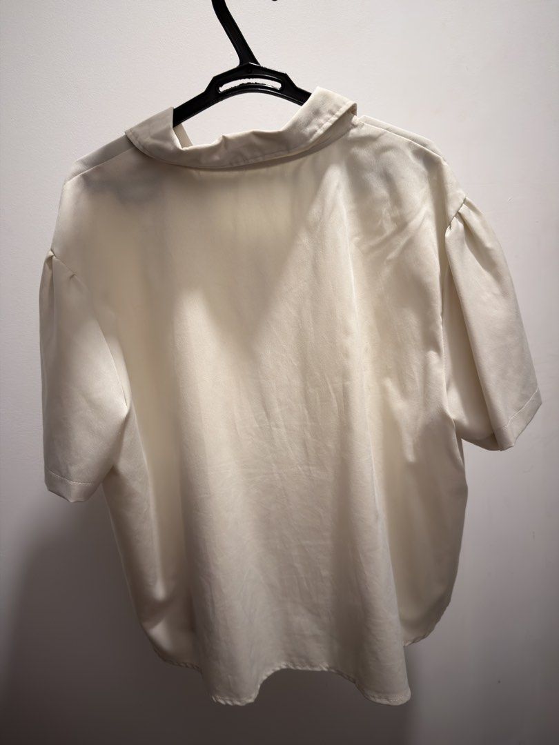 bangkok plus size cream peter pan collar blouse (Category: Blouses) located in Pasig City. Submitted by tocmoon (Listing ID 1435900110, Image 3). Description: - like new plus size cream-coloured blouse with pan collar and tie detail - purchased from bangkok, no tags but i think it’s about 1xl-2xl but still loose/flowy - for shipment only, loc cainta .