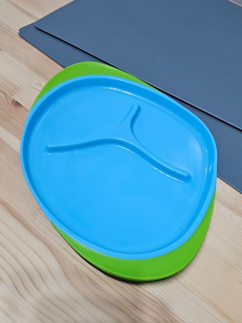 b.box Divided Plate (Category: Other Kitchenware & Tableware) located in Manila. Submitted by bonitalamama (Listing ID 1435726400, Image 1). Description: - B.box divided plate, ideal for toddlers. - Features a vibrant blue center and green rim. - Designed with three sections to separate food. - Made from durable, easy-to-clean plastic. - Perfect for mealtimes at home or while traveling..