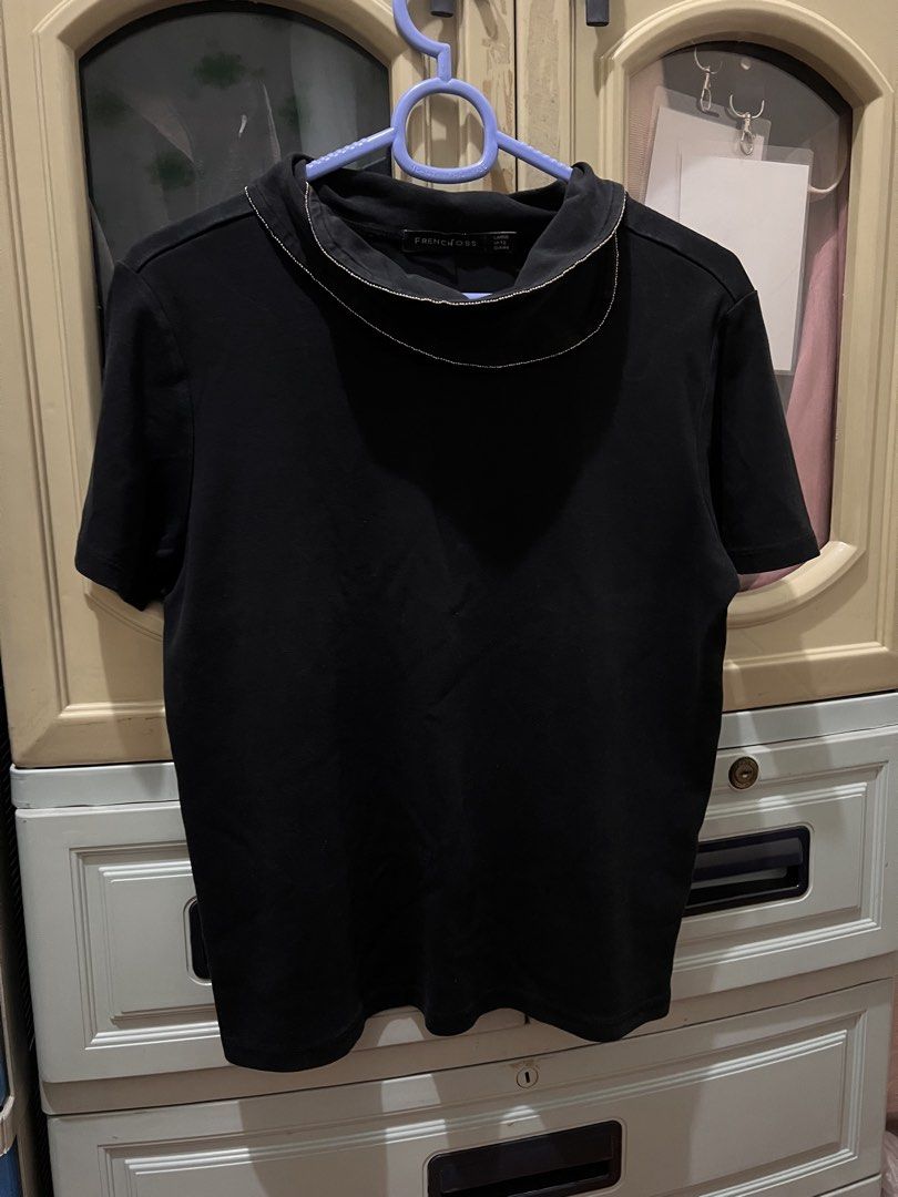 Black shirt / blouse with ruffled collar Size L (Category: Blouses) located in Manila. Submitted by jovalbarez (Listing ID 1435839786, Image 1). Description: Brand: Frenchtoss Color: Black Material: 100% Cotton Shoulder: 15.5 in Sleeve: 7 in Length: 21 in Width: 18 in Has ruffled collar with necklace bead lining (refer to photos). Already in last price..