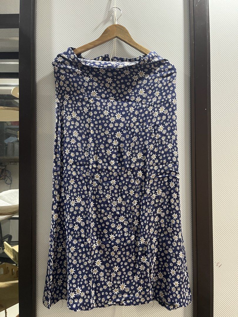 Blue Floral Maxi Skirt (Category: Skirts) located in Quezon City. Submitted by dnnptn (Listing ID 1435723517, Image 1). Description: - Navy blue midi skirt - White floral pattern - High-waisted - Flowy silhouette - Lightweight fabric - Comfortable fit - Versatile style DM for exact measurements .