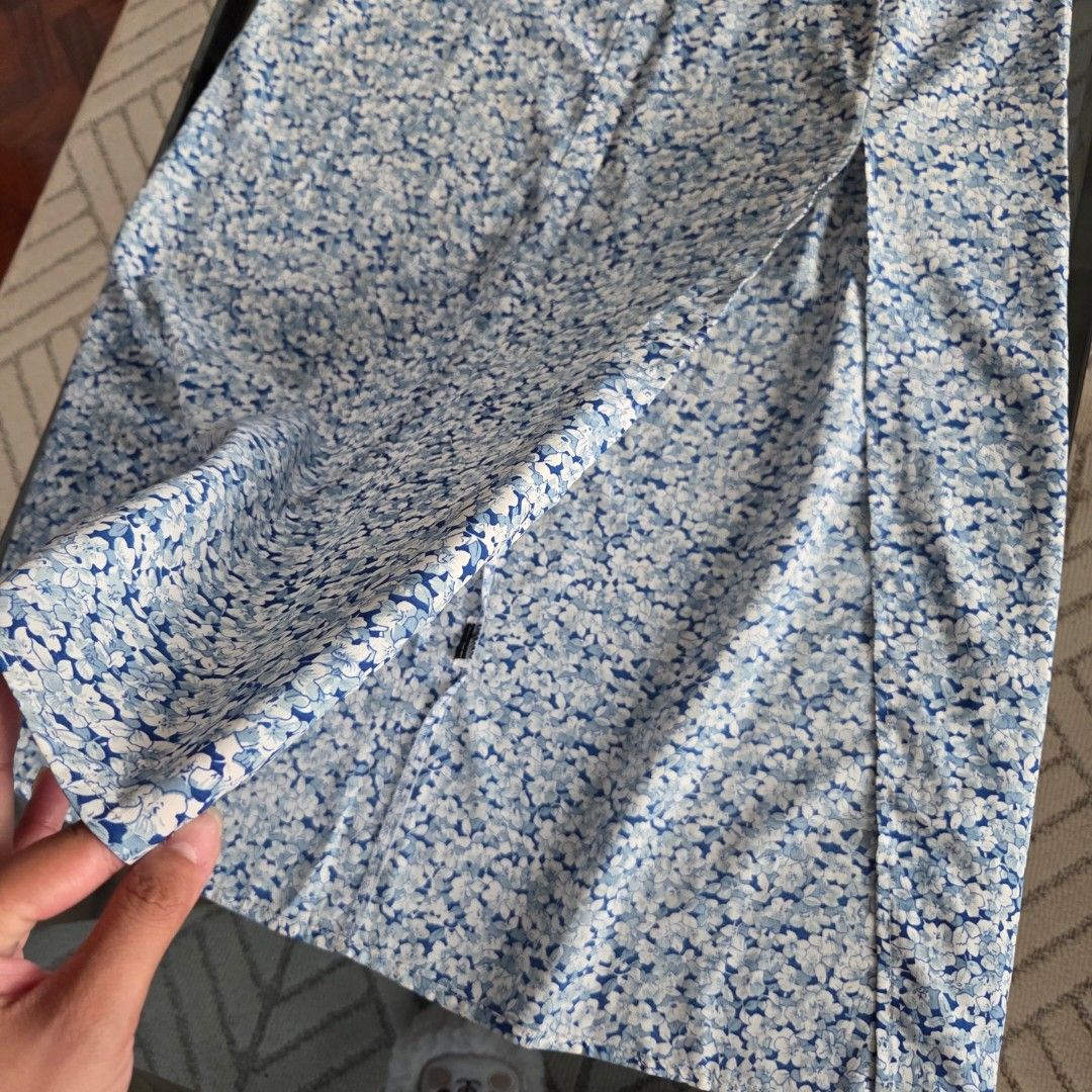 Blue Floral Maxi Skirt (Category: Skirts) located in Cebu City. Submitted by minkbuys (Listing ID 1435821430, Image 3). Description: - Blue and white floral maxi skirt - Features a stylish front slit - Made of lightweight fabric - Comfortable and flowy fit - Ideal for warm weather.