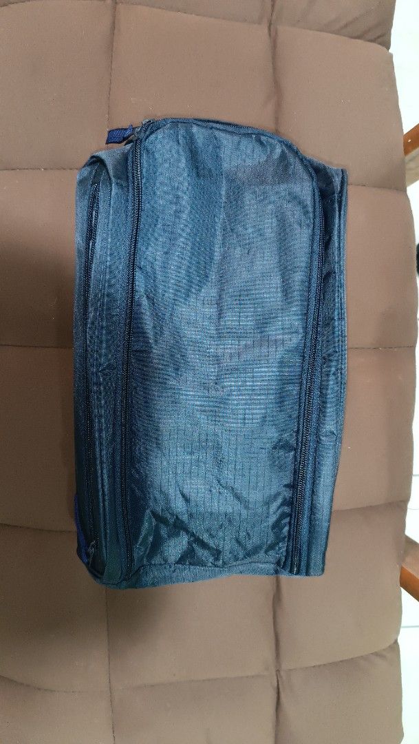 Blue Travel Organizer Bag (Category: Belt bags, Clutches and Pouches) located in Manila. Submitted by rmflores888 (Listing ID 1435810292, Image 1). Description: - Blue travel organizer bag - Rectangular shape with a handle - Features multiple zippers for secure storage - Made of durable, potentially water-resistant material - Compact design for easy carrying - Perfect for travel or organizing essentials.