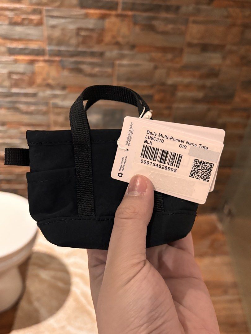 [BRAND NEW] Lululemon Multipocket Nano Tote Wallet (Category: Luxury Bags & Wallets) located in Manila. Submitted by ponyo111 (Listing ID 1435874976, Image 3). Description: - Bought in Japan - Unused with tags - Unique style and rare to find Rfs: Don’t want anymore.