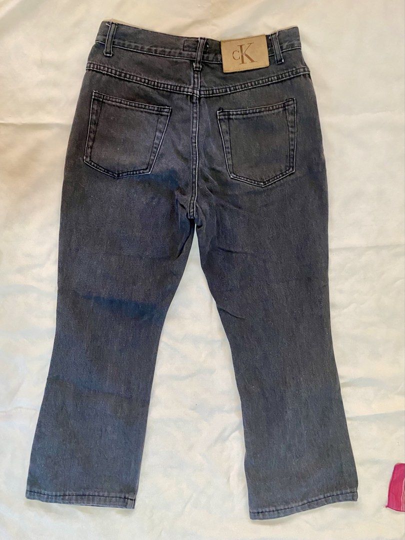 Calvin Klein Dark Grey Black Bootcut Midrise Jeans (Category: Jeans) located in Las Pinas. Submitted by coolc4t (Listing ID 1435797855, Image 2). Description: - Dark grey wash Calvin Klein jeans - Bootcut leg - Button closure - Calvin Klein logo detail - Two front pockets - Two back pockets - Classic and versatile design RFS: Decluttering DM for inquiries!.