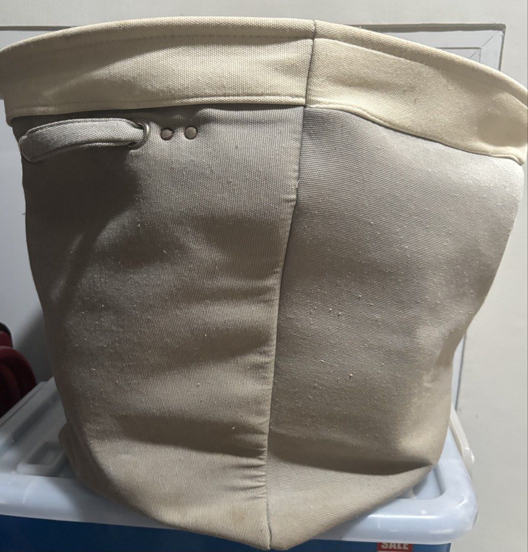 Canvas Laundry Basket with Handles (Category: Laundry Baskets) located in Mandaluyong City. Submitted by joebren24 (Listing ID 1435799311, Image 2). Description: - Canvas laundry basket - Features hand wash graphic - Sturdy handles for easy carrying - Neutral color scheme (light beige rim and handles) - Cylindrical shape - Made of durable canvas material - Ideal for laundry or household storage - collapsible - H (43 cm) - W (39 cm x 54 cm).