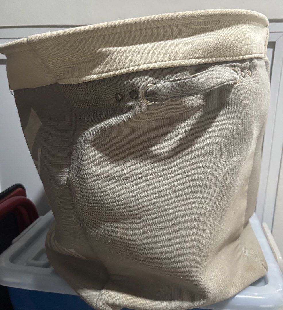 Canvas Laundry Basket with Handles (Category: Laundry Baskets) located in Mandaluyong City. Submitted by joebren24 (Listing ID 1435799311, Image 3). Description: - Canvas laundry basket - Features hand wash graphic - Sturdy handles for easy carrying - Neutral color scheme (light beige rim and handles) - Cylindrical shape - Made of durable canvas material - Ideal for laundry or household storage - collapsible - H (43 cm) - W (39 cm x 54 cm).