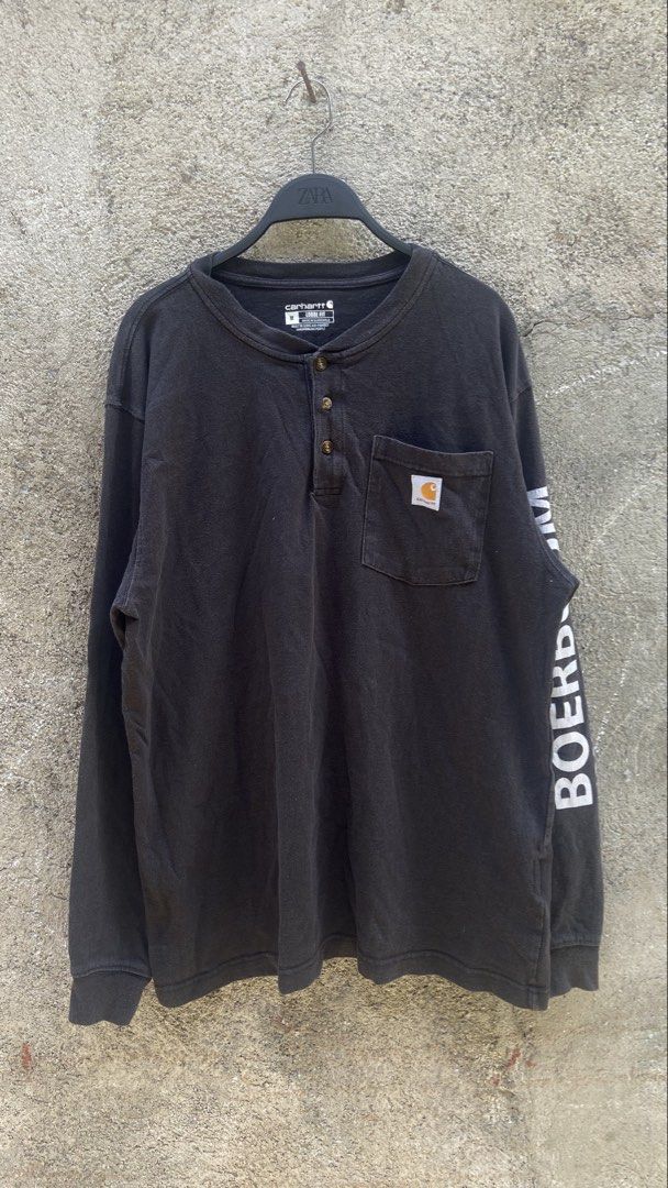 Carhartt Long Sleeve (Category: Tshirts & Polo Shirts ) located in Siniloan. Submitted by urflyestsource2k (Listing ID 1435743834, Image 1). Description: - Carhartt long sleeve shirt - Henley neckline - Black color - Size: Medium - Features a chest pocket - "BOERBOOM" print on sleeve - Loose fit.