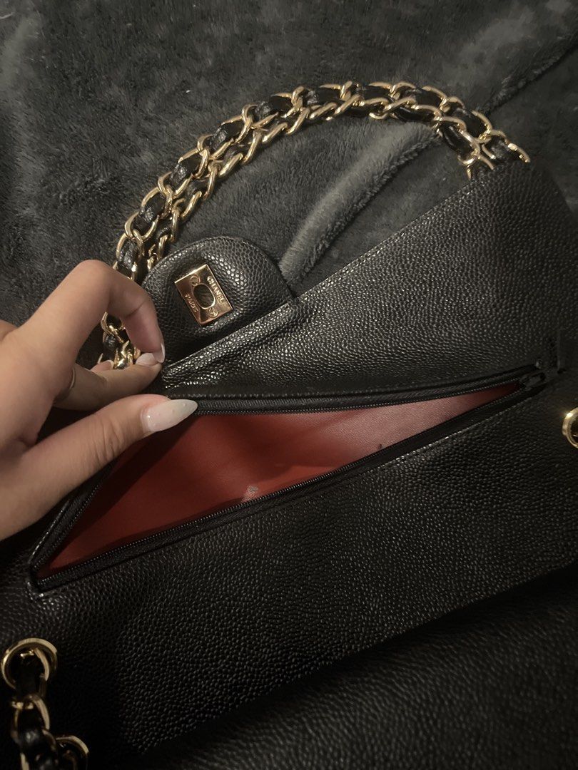 Chanel Classic Flap Bag (Category: Luxury Bags & Wallets) located in Malabon City. Submitted by justprelovedbyazi (Listing ID 1435888789, Image 2). Description: - Chanel Classic Flap bag - Black quilted exterior - Gold-tone hardware - Chain strap - Red interior with zippered pocket - Made in France.