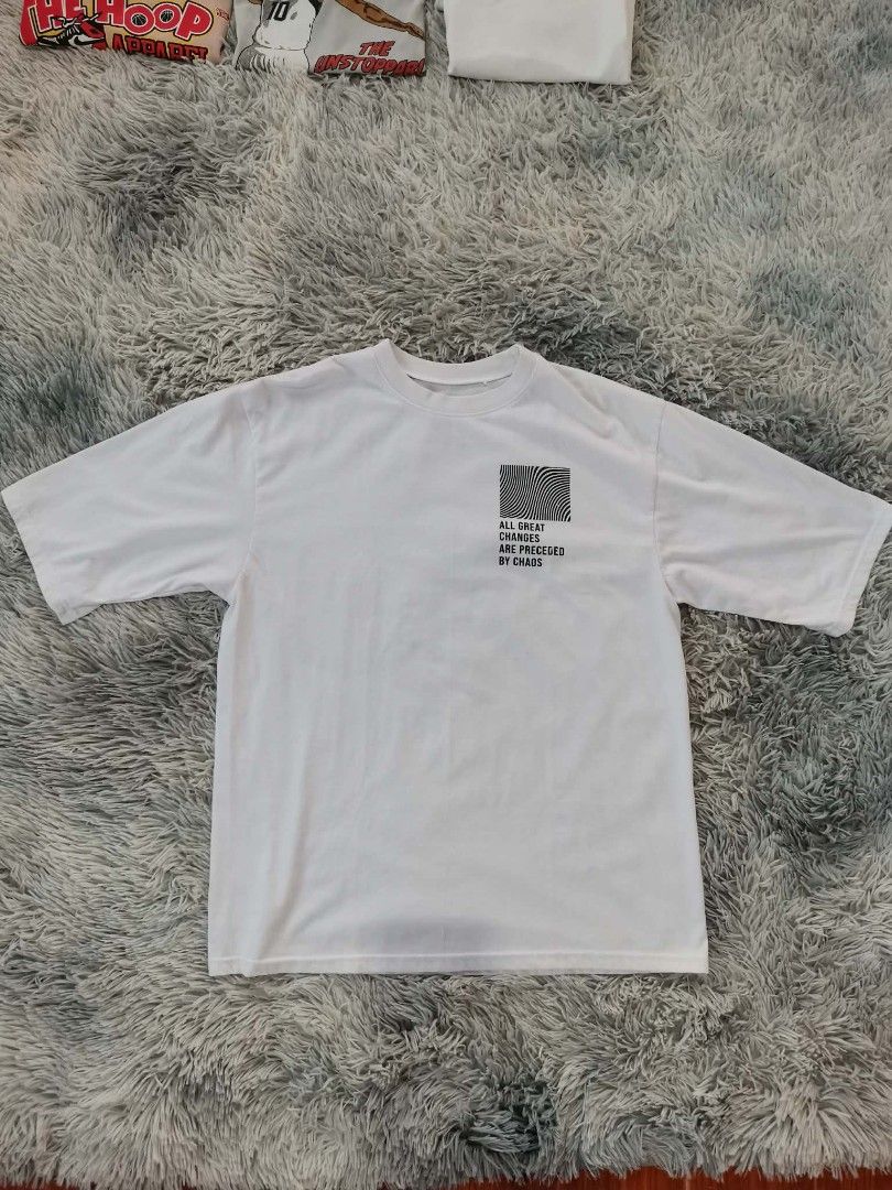 Chaos" Street Oversized Shirt (Category: Tshirts & Polo Shirts ) located in Manila. Submitted by softlywornbyelli_10 (Listing ID 1435739912, Image 2). Description: Product Highlights Brand: INSPI (often part of their Street or Daydreamer collections) Fit: Oversized/Unisex Graphics: Features a distinctive "CHAOS" back print with a grid of abstract and space-themed illustrations Color: Available in Ivory/White and Black Material: Typically made fro