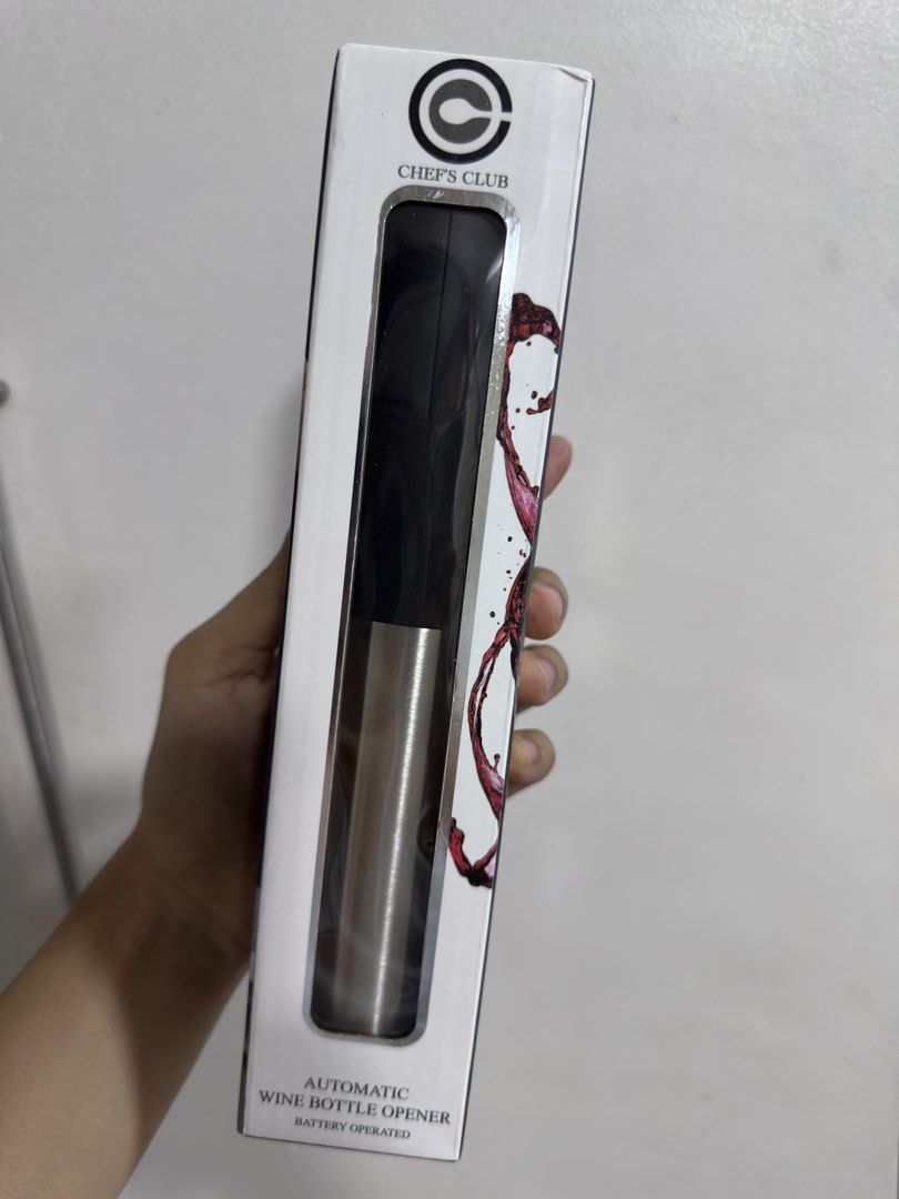 Chef's Club Automatic Wine Bottle Opener (Category: Other Kitchenware & Tableware) located in Rizal. Submitted by GirlDeclutter (Listing ID 1435824584, Image 2). Description: - Chef's Club Automatic Wine Opener - Battery-operated for easy use - Features release and extract buttons - Includes a foil cutter - Perfect for wine lovers!.