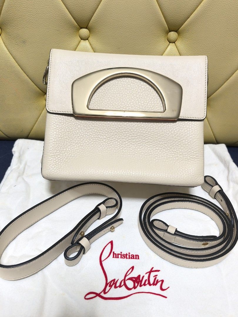 Christian Louboutin Handbag with Shoulder Strap (Category: Luxury Bags & Wallets) located in Makati City. Submitted by reiven2017 (Listing ID 1435893865, Image 1). Description: - Christian Louboutin handbag - Light beige color - Gold-toned handle - Two detachable straps - Red fabric interior - Includes dust bag with logo -almost new -bought abroad.