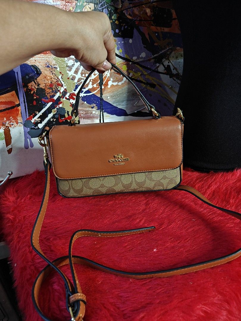 Coach Brown Crossbody Handbag (Category: Luxury Bags & Wallets) located in Las Pinas. Submitted by liezel49 (Listing ID 1435874529, Image 2). Description: - Authentic Coach handbag - Brown leather exterior - Signature Coach pattern on the bottom - Top handle and detachable crossbody strap - Light-colored fabric lining - Interior pocket - Gold-tone hardware - Flap closure.
