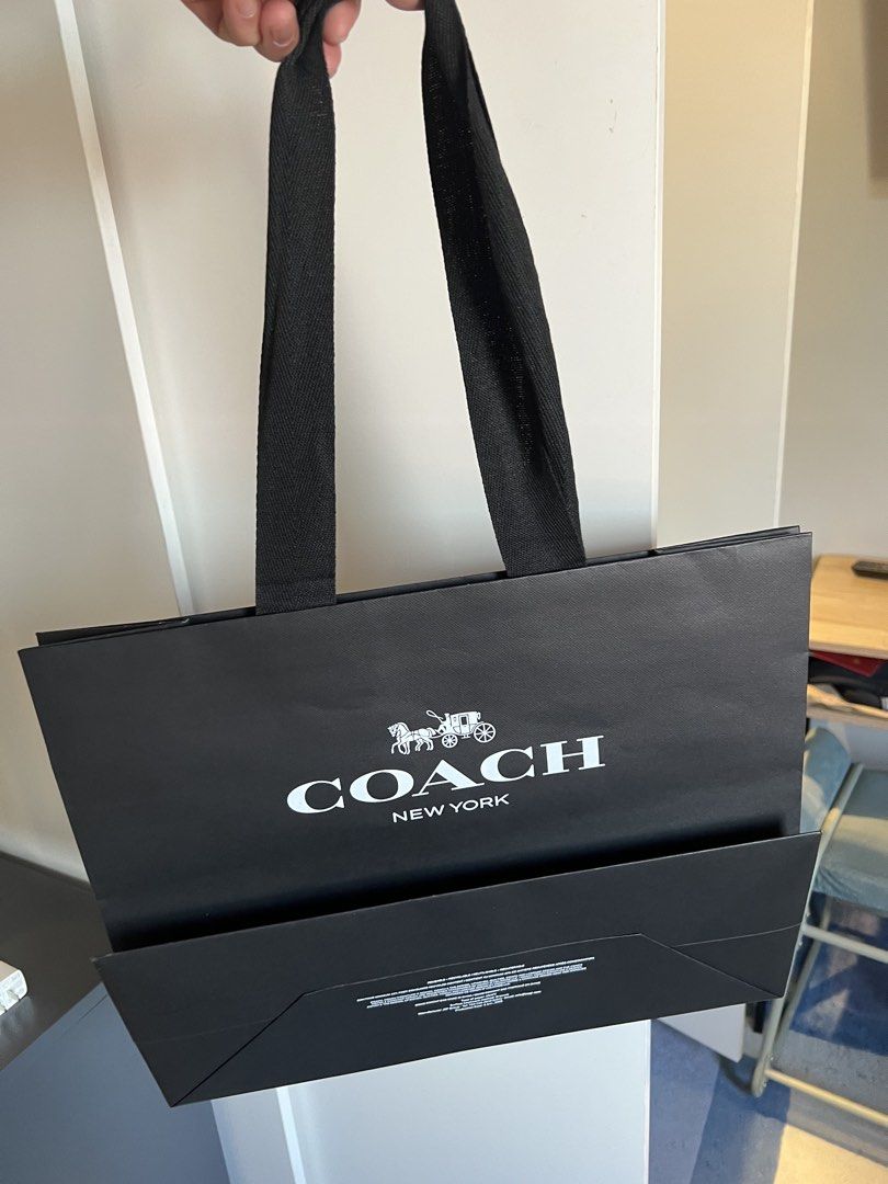 Coach Paper Shopping Bag (Category: Luxury Bags & Wallets) located in Makati City. Submitted by marckyboy (Listing ID 1435813700, Image 1). Description: - Authentic Coach paper shopping bags - Includes both black and brown bags - Features the Coach logo and "New York" text - Black bags have black handles - Brown bags have twisted paper handles - Perfect for gifting or collecting - 600 each.