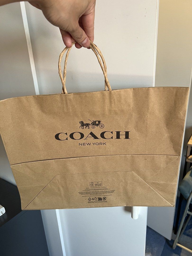Coach Paper Shopping Bag (Category: Luxury Bags & Wallets) located in Makati City. Submitted by marckyboy (Listing ID 1435813700, Image 3). Description: - Authentic Coach paper shopping bags - Includes both black and brown bags - Features the Coach logo and "New York" text - Black bags have black handles - Brown bags have twisted paper handles - Perfect for gifting or collecting - 600 each.
