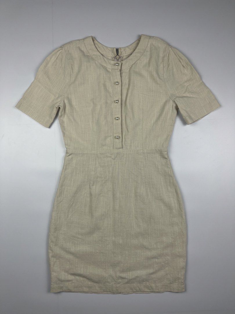 Cream Pearl-Button Linen Mini Dress (Category: Dresses) located in Cagayan de Oro. Submitted by kmcurations (Listing ID 1435848102, Image 1). Description: Cream Pearl-Button Linen Mini Dress • PHP 200 • Elegant short-sleeve mini dress in a textured cream linen fabric • Features a sophisticated round neckline and a row of classic pearl-like buttons on the front bodice • Designed with a flattering cinched waist and a secure back zipper closure • Fu