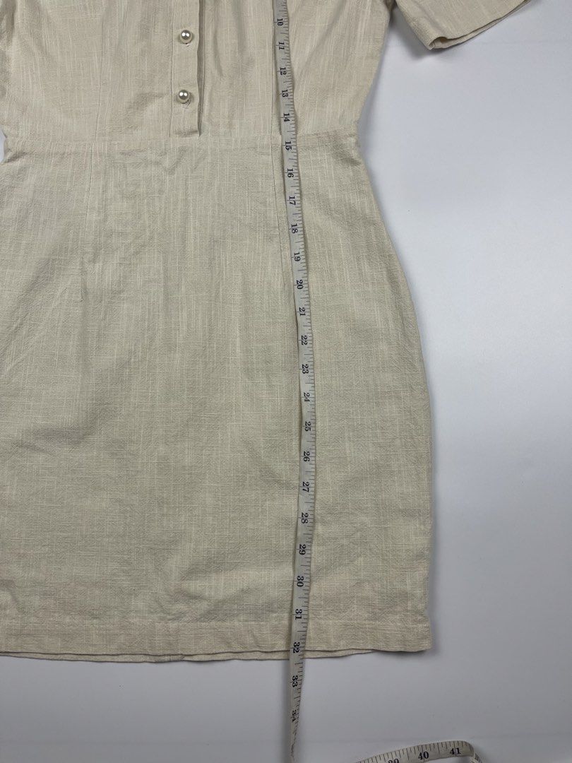 Cream Pearl-Button Linen Mini Dress (Category: Dresses) located in Cagayan de Oro. Submitted by kmcurations (Listing ID 1435848102, Image 2). Description: Cream Pearl-Button Linen Mini Dress • PHP 200 • Elegant short-sleeve mini dress in a textured cream linen fabric • Features a sophisticated round neckline and a row of classic pearl-like buttons on the front bodice • Designed with a flattering cinched waist and a secure back zipper closure • Fu