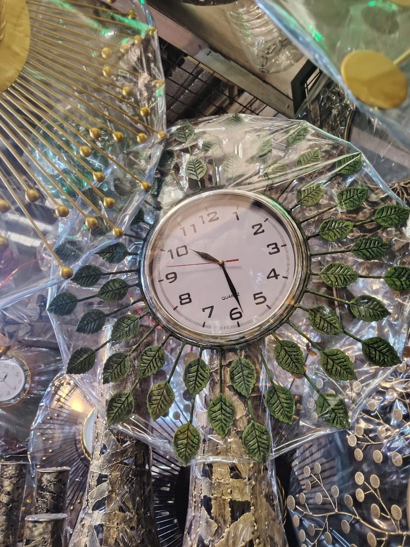 Decorative Wall Clocks (Category: Clocks) located in Caloocan City. Submitted by youngbird_a8dc34 (Listing ID 1435771035, Image 1). Description: - Unique wall clock designs - Available in leaf and sunburst styles - Quartz movement - Clear, easy-to-read face - Adds a decorative touch to any room.