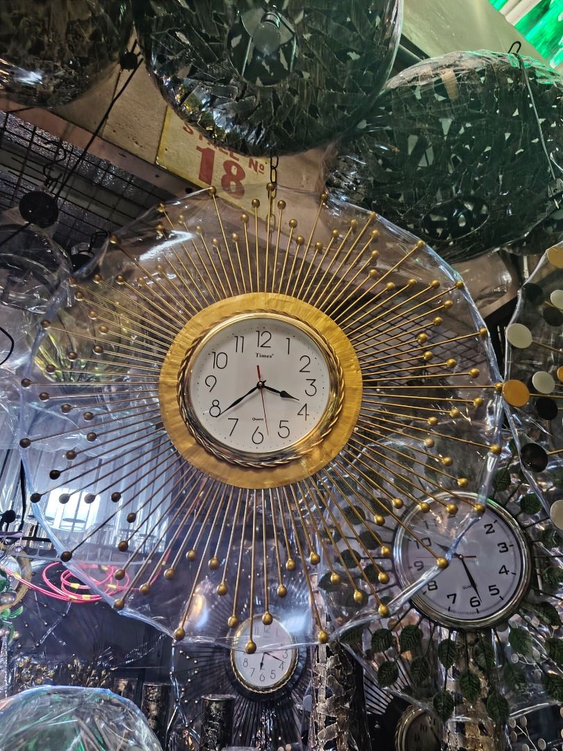 Decorative Wall Clocks (Category: Clocks) located in Caloocan City. Submitted by youngbird_a8dc34 (Listing ID 1435771035, Image 3). Description: - Unique wall clock designs - Available in leaf and sunburst styles - Quartz movement - Clear, easy-to-read face - Adds a decorative touch to any room.