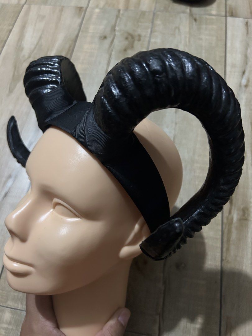 Devil Demon Goat Black Horn Headband Costume Accessory (Category: Hair Accessories) located in Paranaque City. Submitted by zac.sei (Listing ID 1435867893, Image 2). Description: - Black horn headband - Features large, curved horns - Textured horn surface - Secure fit - Ideal for costumes and themed events.