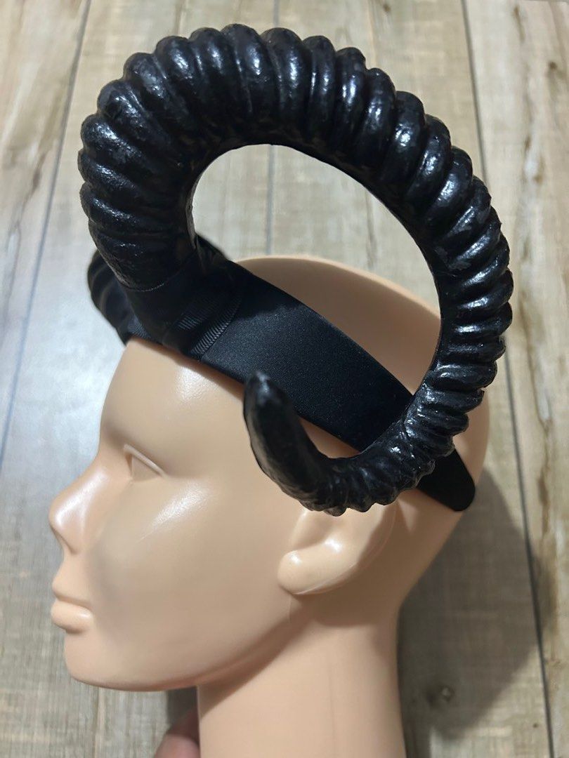 Devil Demon Goat Black Horn Headband Costume Accessory (Category: Hair Accessories) located in Paranaque City. Submitted by zac.sei (Listing ID 1435867893, Image 3). Description: - Black horn headband - Features large, curved horns - Textured horn surface - Secure fit - Ideal for costumes and themed events.
