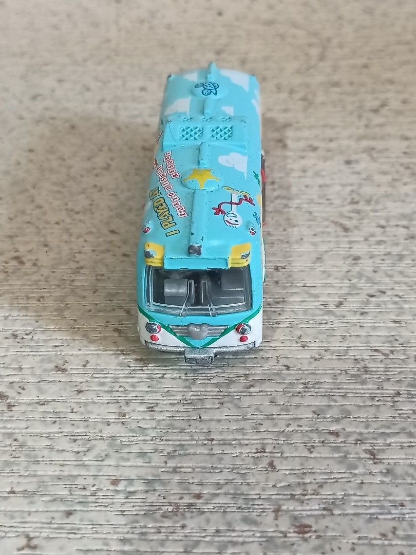 Disney Pixar Toy Story Bus (Category: Vehicle & Diecast Models) located in Quezon City. Submitted by Bernz (Listing ID 1435765639, Image 1). Description: - Toy Story themed bus toy - Light blue body with Toy Story character designs - Mickey Mouse design on the back - Opening door - White and yellow interior.