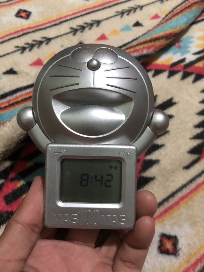 Doraemon silver desk timer and clock (Category: Clocks) located in Quezon City. Submitted by markgolveo (Listing ID 1435837136, Image 1). Description: Doraemon silver desk timer and clock Tested working Good display and sounds Press and hold to operate.